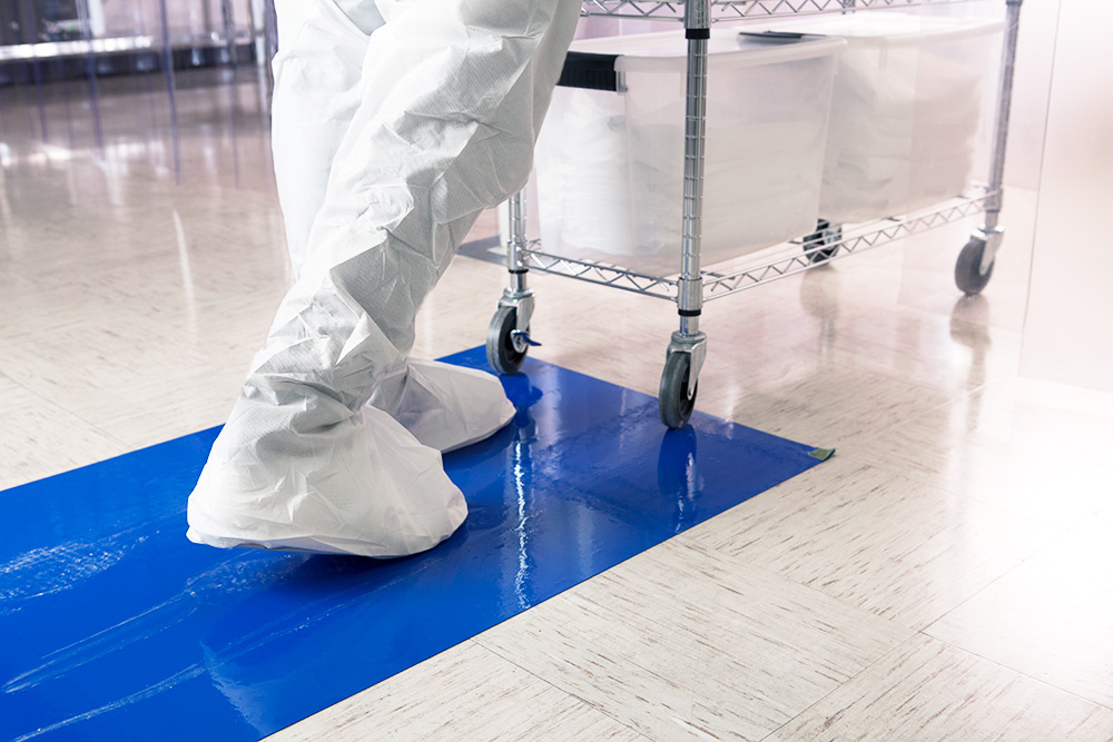 Employee walking on cleanroom mat